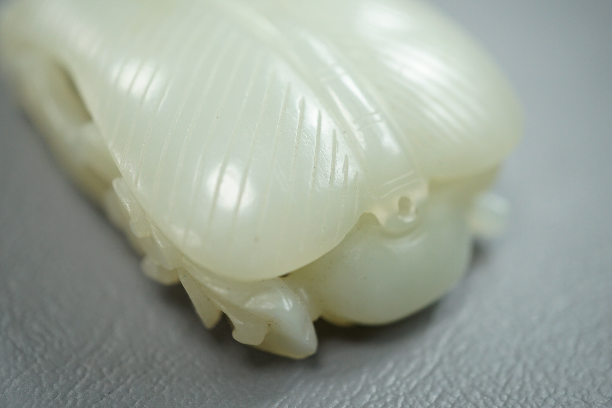 A Chinese pale celadon jade carving of Sun Wukong, the Monkey King, 18th/19th century